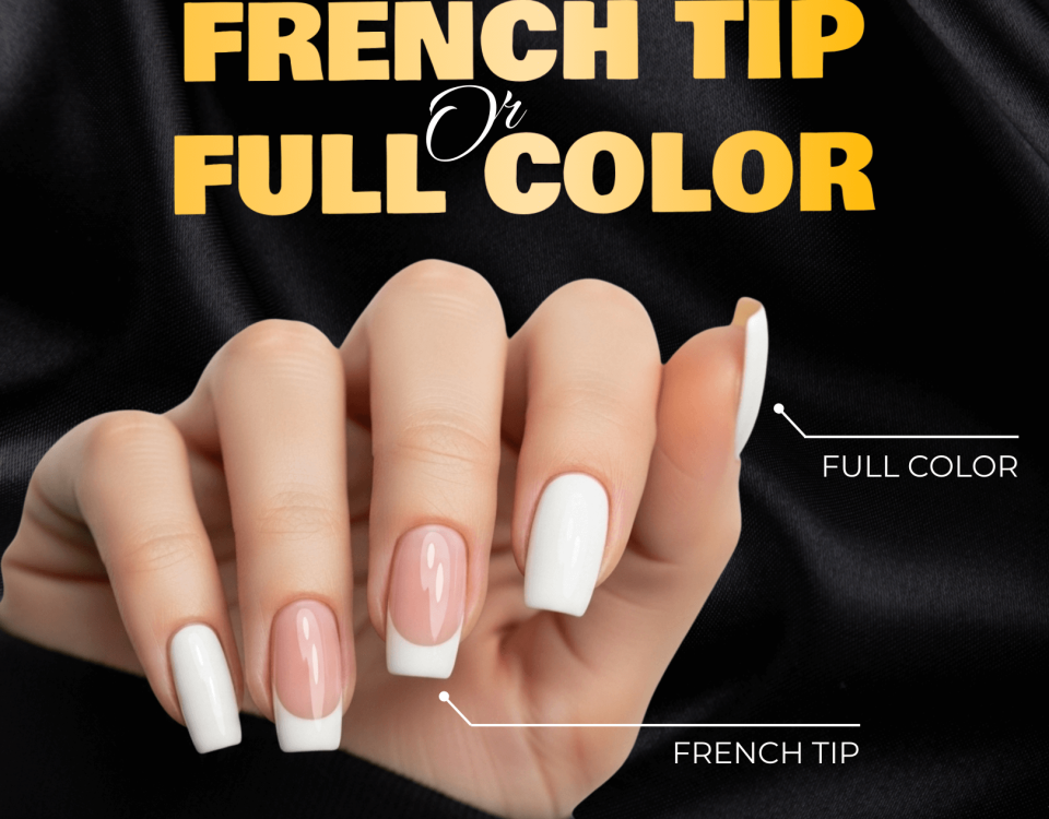 A hand with French Tip and Full Color manicures on a satin background.